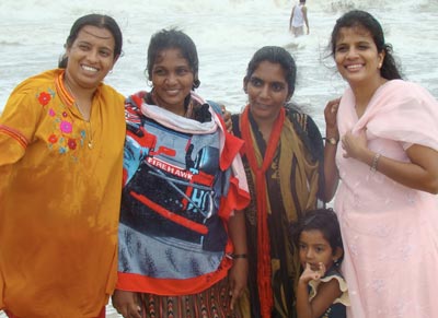Shirly, Malar and Debbie rejoice during the baptism of Catherine (second from left)!
